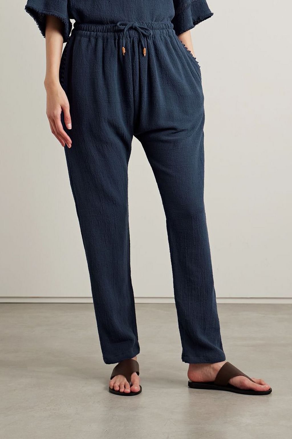 CARAVANA Wakun leather-trimmed distressed cotton-gauze track pants
