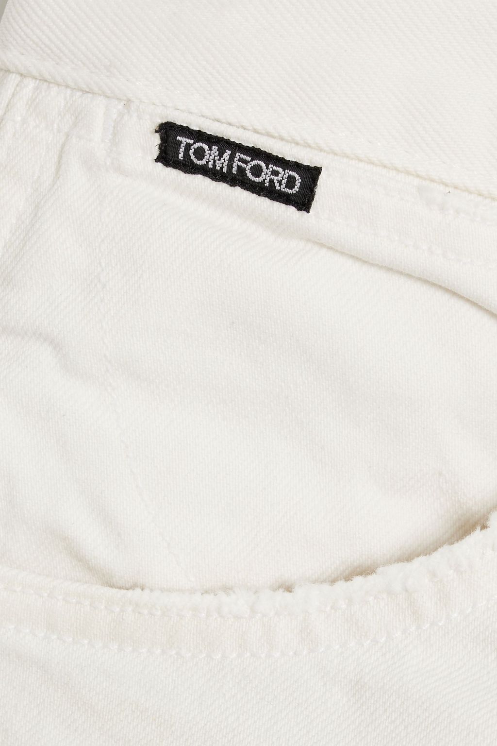TOM FORD بنطال من الدنيم جينز بقصة تضيق تدريجيًا بتأثير معتق ومزين بطبعات
