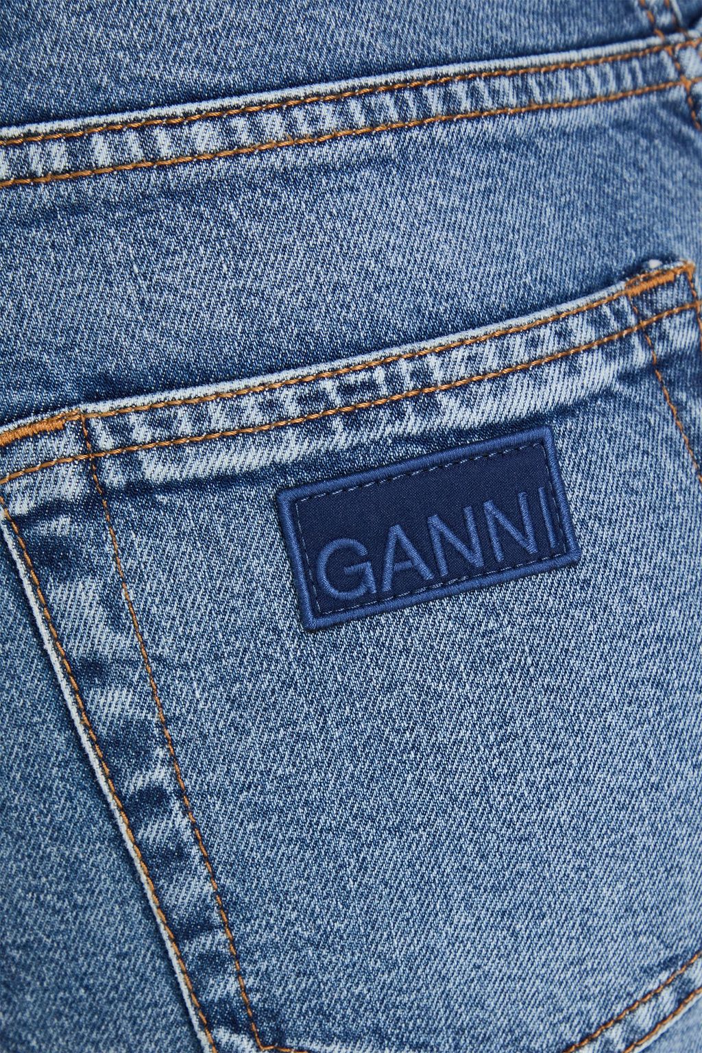 GANNI بنطال جينز بأرجل مستقيمة وبخصر عالٍ