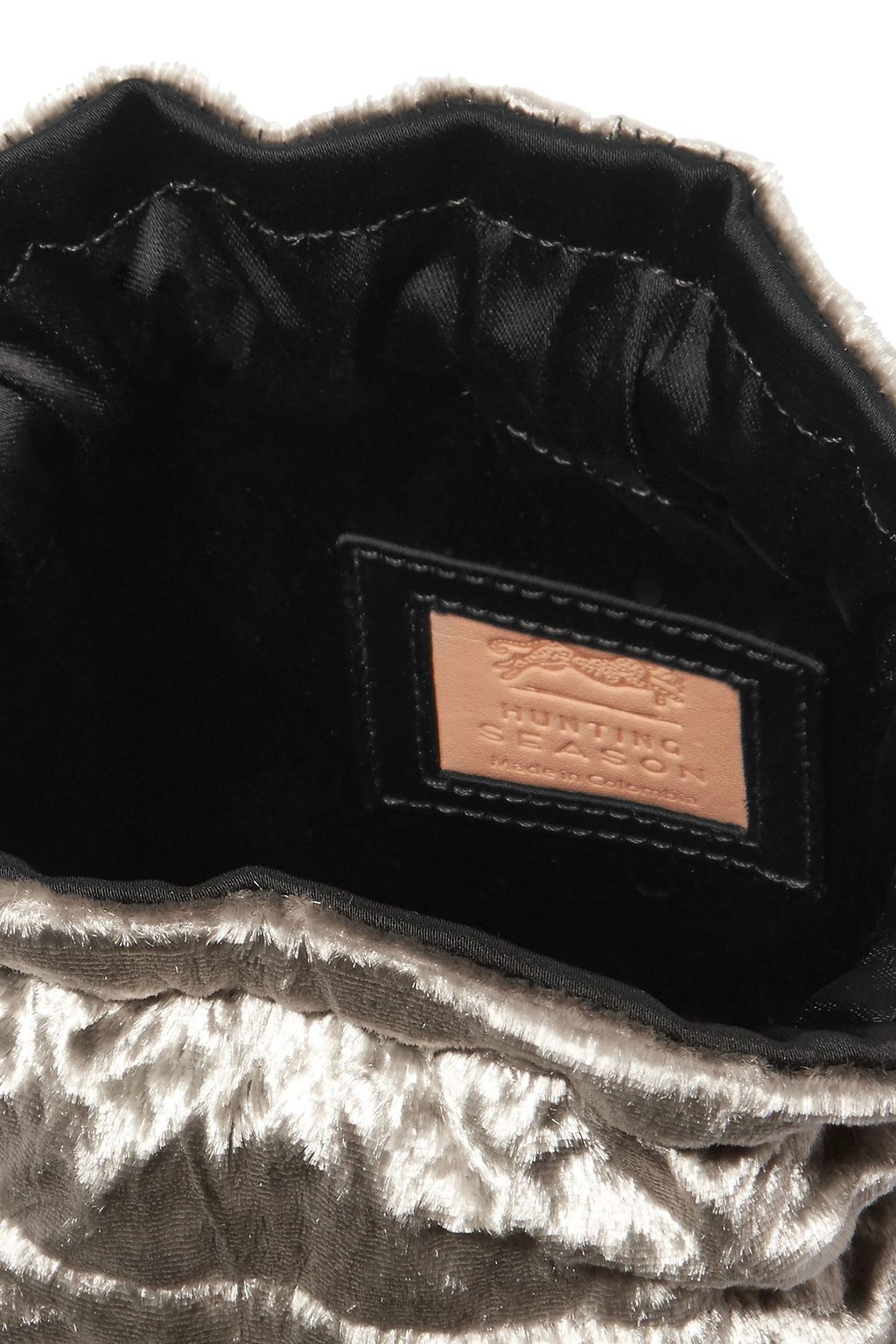 HUNTING SEASON Tasseled velvet pouch