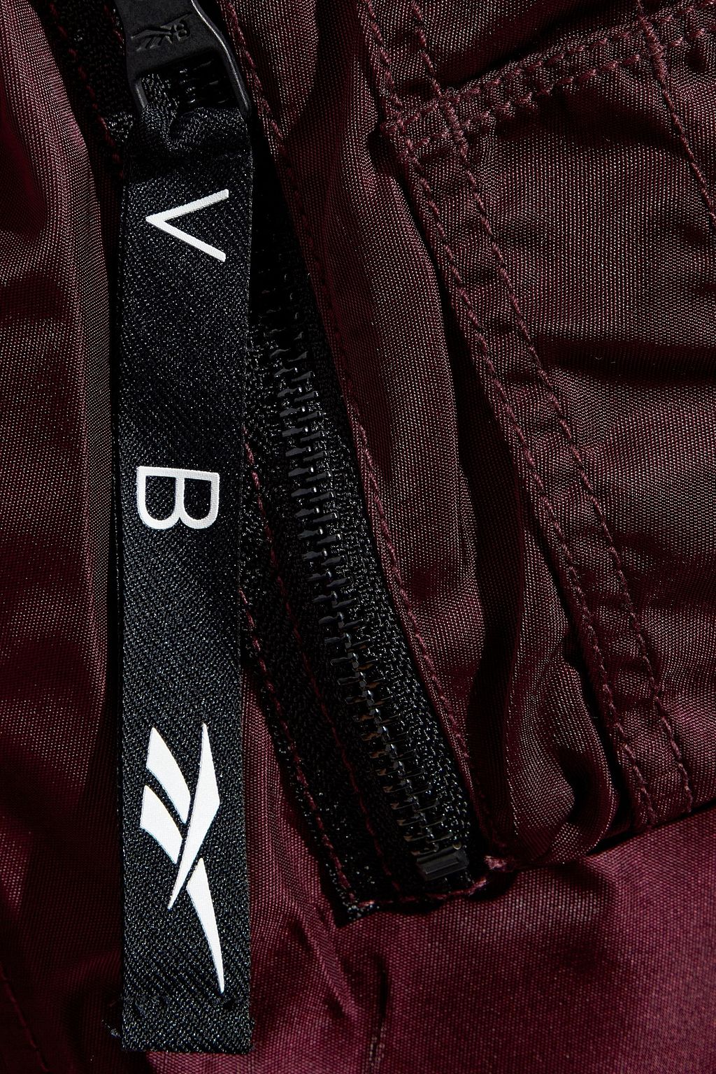 REEBOK X VICTORIA BECKHAM Grosgrain-appliquéd shell padded bomber jacket