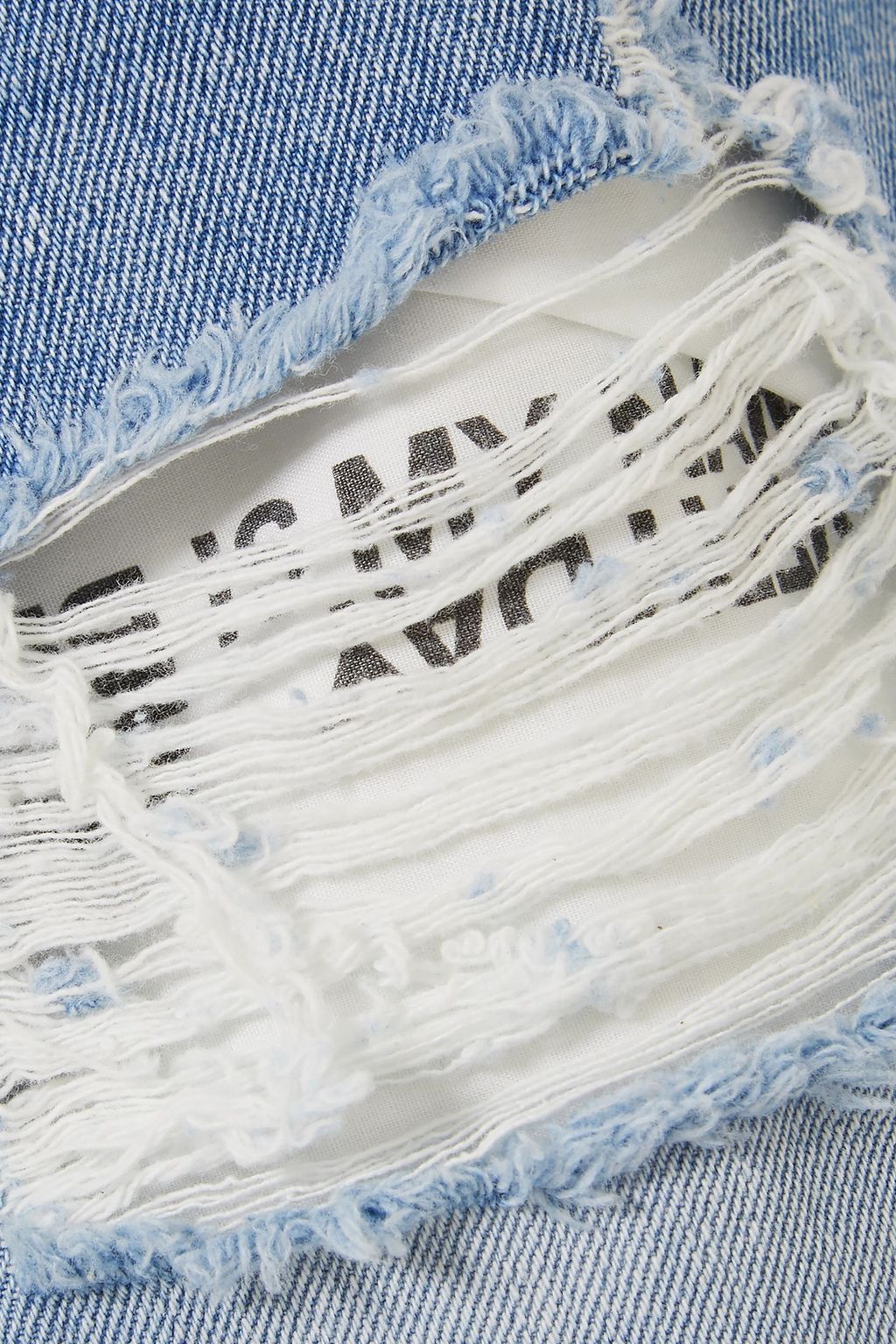 SJYP Distressed denim mini skirt