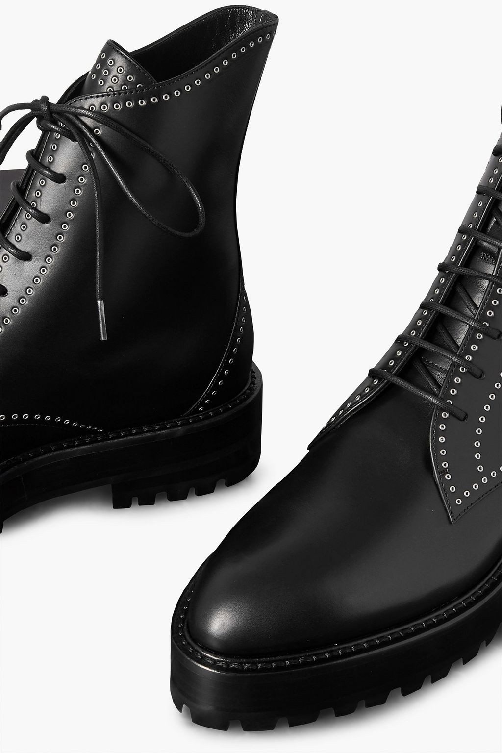 ALAÏA Eyelet-embellished leather combat boots