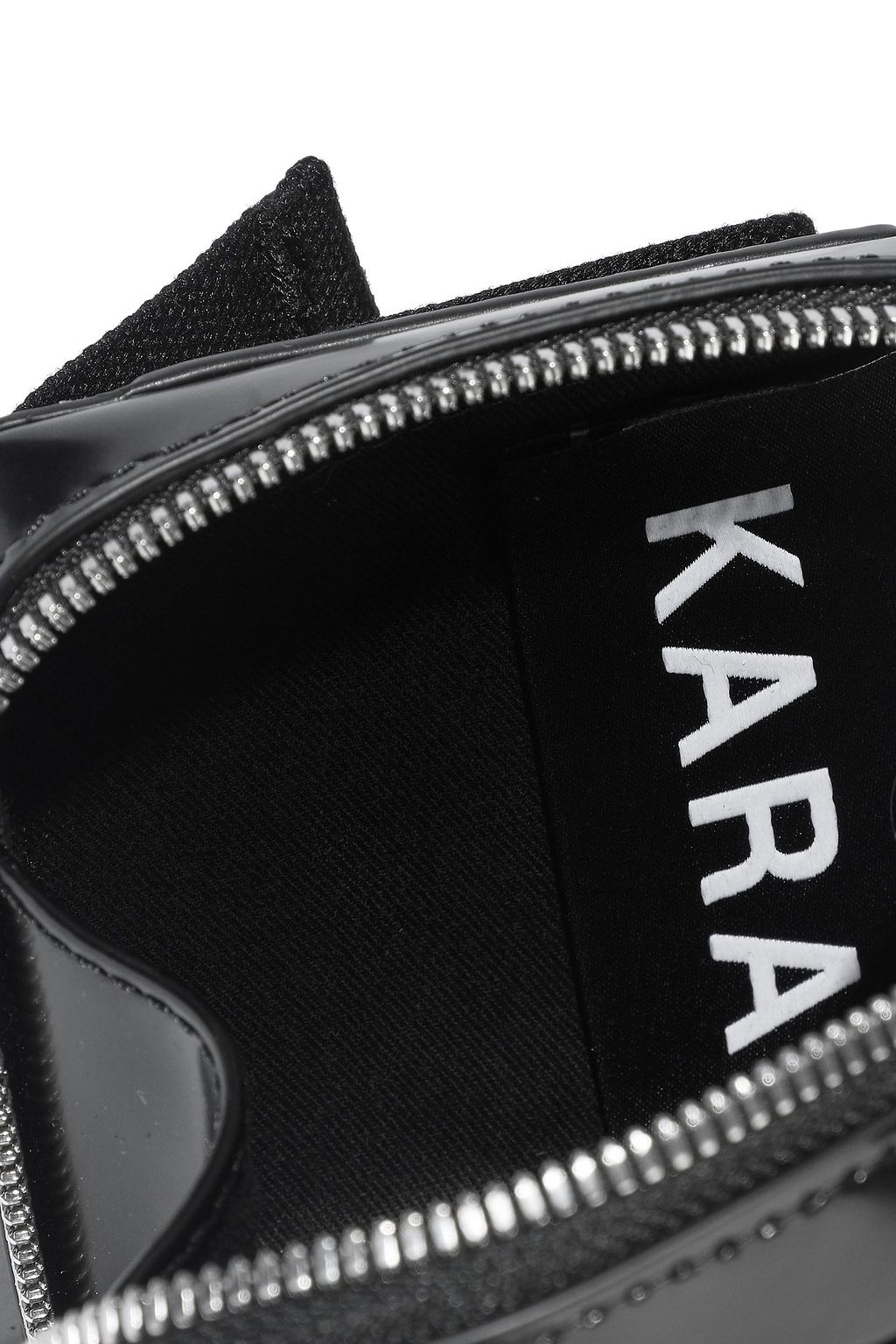 KARA Void glossed-leather belt bag